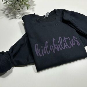 Gildan Black Sweatshirt, Kidabilities puff design in purple color, new, size L